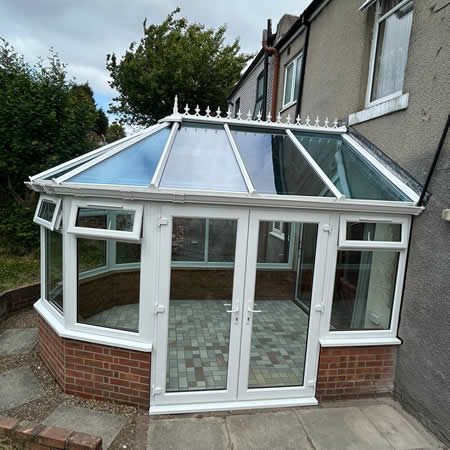Glass and polycarbonate conservatories